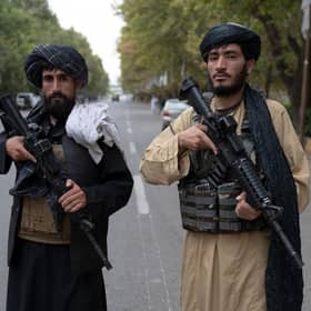 Taliban fighters stand guard near the former presidential palace in Kabul (Picture: Wakil Kohsar/AFP via Getty Images)