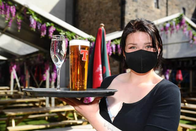 Preparations for opening at the the Three Sisters pub, Grassmarket, Edinburgh