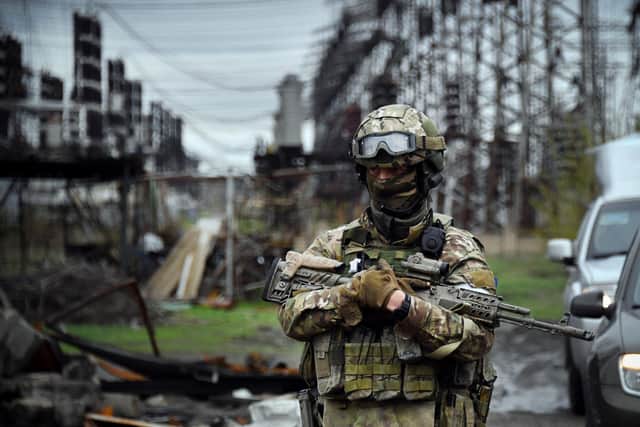 TOPSHOT - In this picture taken on April 13, 2022, a Russian soldier stands guard at the Luhansk power plant in the town of Shchastya. - *EDITOR'S NOTE: This picture was taken during a trip organized by the Russian military.* (Photo by Alexander NEMENOV / AFP) (Photo by ALEXANDER NEMENOV/AFP via Getty Images)
