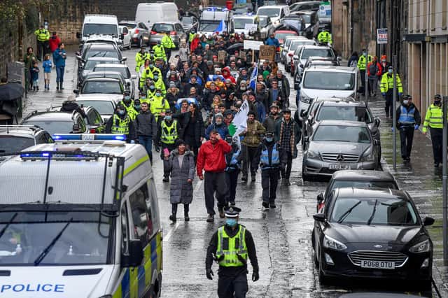 Protesters marched from the Scottish Parliament to Bute House on Saturday.