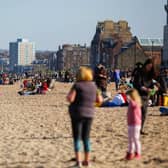 People flocked to Edinburgh's Portobello Beach to enjoy the sun