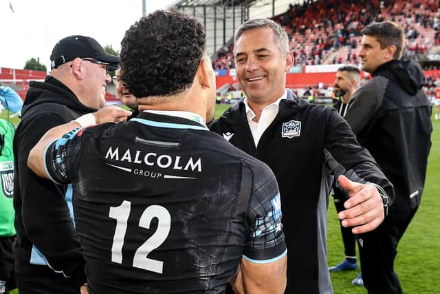Glasgow Warriors' Sione Tuipulotu (no 12) celebrates with head coach Franco Smith after the semi-final win over Munster, with defence coach Pete Murchie on the right.  (Photo by Ben Brady/INPHO/Shutterstock)