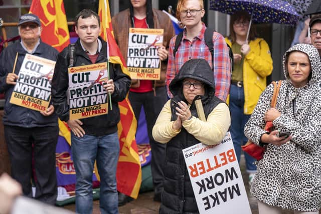 People take part in a trade union pay protest on Buchanan Street, Glasgow, as bin workers walk out in several council areas (Picture: Jane Barlow/PA Wire)
