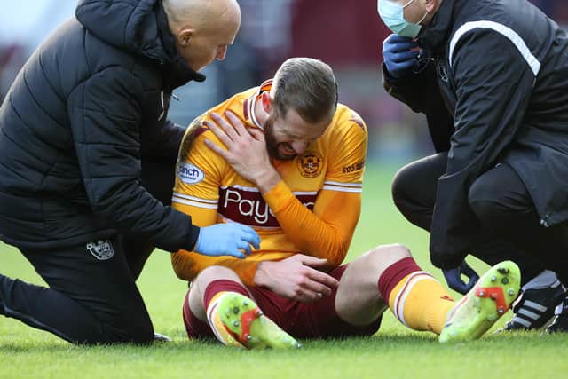 Motherwell's Kevin van Veen clutches his shoulder during last weekend's 1-1 draw with Aberdeen at Fir Park. (Photo by Alan Harvey / SNS Group)