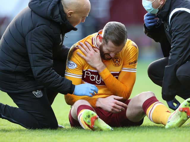 Motherwell's Kevin van Veen clutches his shoulder during last weekend's 1-1 draw with Aberdeen at Fir Park.  (Photo by Alan Harvey / SNS Group)