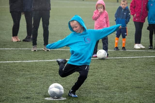 Trying his hand at a penalty kick was this lad.