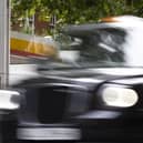 A London taxi drives past a petrol station. Picture: Dan Kitwood/Getty Images