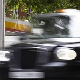 A London taxi drives past a petrol station. Picture: Dan Kitwood/Getty Images