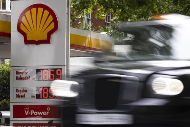 A London taxi drives past a petrol station. Picture: Dan Kitwood/Getty Images