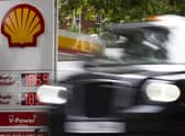 A London taxi drives past a petrol station. Picture: Dan Kitwood/Getty Images
