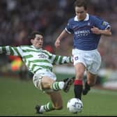 Rangers' Alex Clelland avoids the challenge of Celtic's Jackie McNamara during an Old Firm meeting in January 1998, a few months before the proposal to stage a friendly in Belfast to mark the Good Friday Agreement. Pic: Stu Forster /Allsport