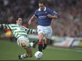 Rangers' Alex Clelland avoids the challenge of Celtic's Jackie McNamara during an Old Firm meeting in January 1998, a few months before the proposal to stage a friendly in Belfast to mark the Good Friday Agreement. Pic: Stu Forster /Allsport