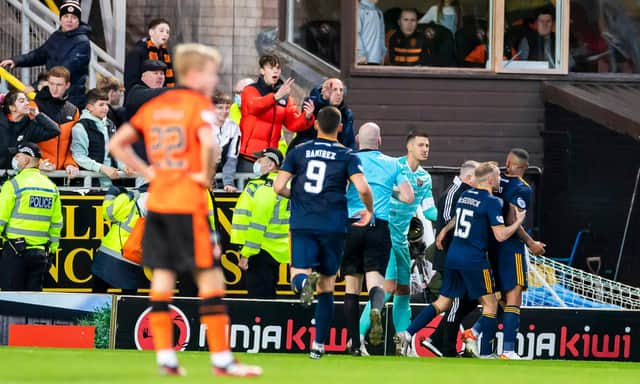 Aberdeen midfielder Funso Ojo was sent off after a confrontation with aDundee United fan. (Photo by Roddy Scott / SNS Group)