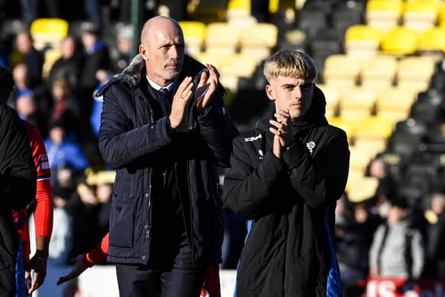 Rangers manager Philippe Clement and Ross McCausland applaud the fans at full time.