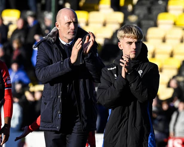 Rangers manager Philippe Clement and Ross McCausland applaud the fans at full time.