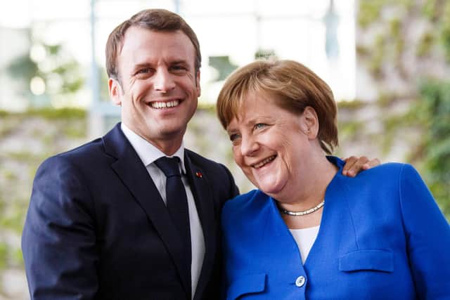 Angela Merkel greets French President Emmanuel Macron at the Chancellery in Berlin in 2019 (Picture: Carsten Koall/Getty Images)