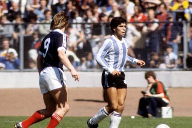 Diego Maradona in action against Kenny Dalglish during a friendly between Scotland and Argentina in 1979