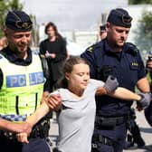 Climate activist Greta Thunberg is carried away by police officers after taking part in a protest in Malmo, Sweden, on July 24 (Picture: Andreas Hillergren/TT News Agency/AFP via Getty Images)