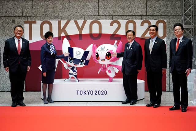 The unveiled statues of Miraitowa and Someity, officials mascots for the Tokyo 2020 Olympics and Paralympics, are seen to mark 100 days before the start of the Games.