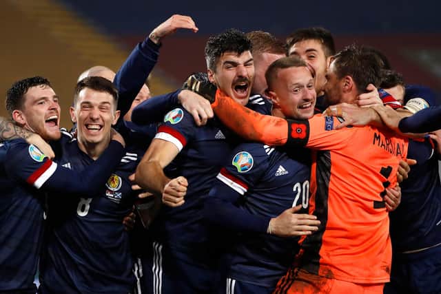 Celebration time for Scotland following the win in Serbia which secured qualification for the Euros. Picture: Srdjan Stevanovic/Getty Images