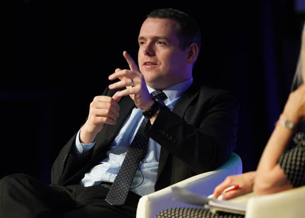 Scottish Conservative Leader Douglas Ross speaking on stage on the second day of the Scottish Conservative party conference at the Scottish Event Campus (SEC) in Glasgow.