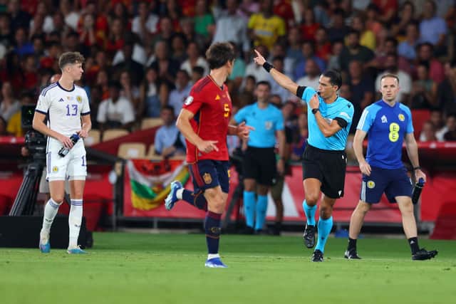 Referee Serdar Gozubuyuk disallows Scott McTominay's goal against Spain. (Photo by Fran Santiago/Getty Images)