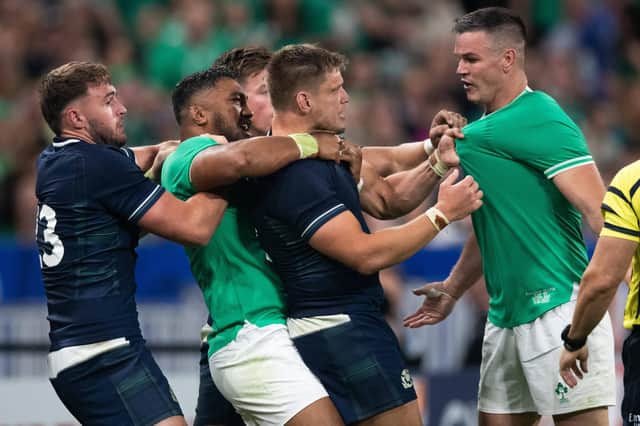 Tensions run high during Scotland's match against Ireland at the Rugby World Cup in Paris after Ollie Smith, left, had tripped Johnny Sexton, right. Bundee Aki and George Turner try to intervene.  (Photo by JEANNE ACCORSINI/SIPA/Shutterstock)