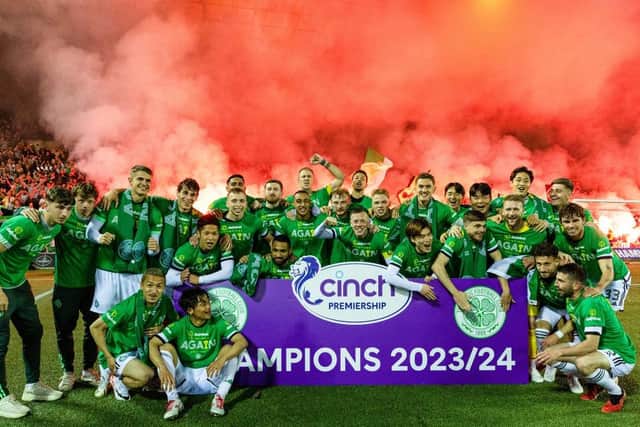 The Celtic squad celebrate in front of the visiting fans after clinching the title at Rugby Park. (Photo by Craig Williamson / SNS Group)