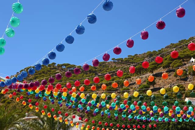 Decorations cover the town of Mijas in Andalusia, Spain, for the annual Virgin of the Rock festival, also known as the Mijas Fair. Pic: PA Photo/Johnny Green.