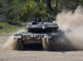 Chancellor Olaf Scholz has agreed to send German-built Leopard tanks to Ukraine and allow other countries to do the same (Picture: Morris MacMatzen/Getty Images)