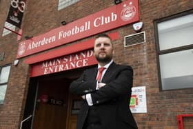 New Aberdeen chief executive Alan Burrows has held talks with caretaker boss Barry Robson.