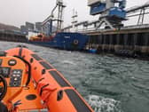 The Kyle Lifeboat crew were called out to tow a boat that became wedged between a pier and a cargo vessel under the Skye Bridge.