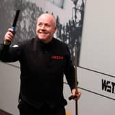 John Higgins of Scotland celebrates victory following their round two match against Kyren Wilson of England on Day Nine of the Cazoo World Snooker Championship 2023.