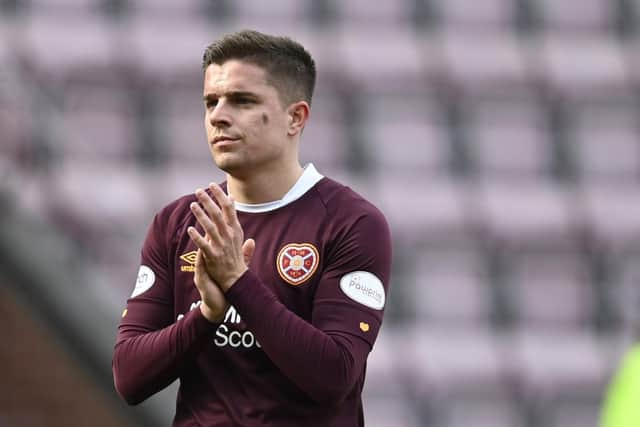 Hearts' Cammy Devlin applauds the fans after the 3-0 defeat by Celtic.