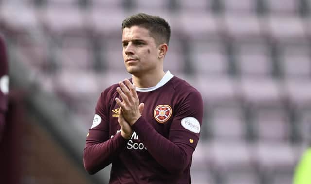Hearts' Cammy Devlin applauds the fans after the 3-0 defeat by Celtic.
