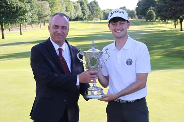 Longniddry's James Morgan, right, is presented with the Cameron Corbett Vase for the second year running at Haggs Castle.