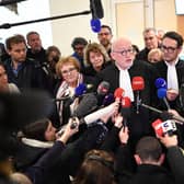 French lawyer Alain Jakubowicz (C) talks to the press next to Ophelie Toulliou, sister of a victim of the crash (2R) at the Paris courthouse on April 17, 2023 after the trial of Air France and plane manufacturer Airbus for the crash of the Rio-Paris Air France flight A330 on June 1, 2009 which killed 228 people.  Photo by Bertrand Guay