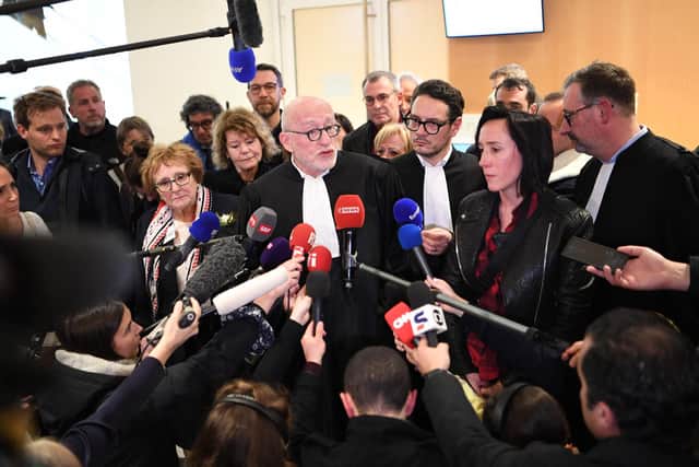 French lawyer Alain Jakubowicz (C) talks to the press next to Ophelie Toulliou, sister of a victim of the crash (2R) at the Paris courthouse on April 17, 2023 after the trial of Air France and plane manufacturer Airbus for the crash of the Rio-Paris Air France flight A330 on June 1, 2009 which killed 228 people.  Photo by Bertrand Guay