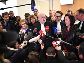 French lawyer Alain Jakubowicz (C) talks to the press next to Ophelie Toulliou, sister of a victim of the crash (2R) at the Paris courthouse on April 17, 2023 after the trial of Air France and plane manufacturer Airbus for the crash of the Rio-Paris Air France flight A330 on June 1, 2009 which killed 228 people.  Photo by Bertrand Guay