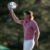 Cameron Smith tips his hat to the crowd on the 18th green after finishing his final round in last year's Masters. Picture: Gregory Shamus/Getty Images.