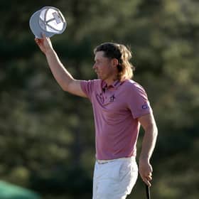 Cameron Smith tips his hat to the crowd on the 18th green after finishing his final round in last year's Masters. Picture: Gregory Shamus/Getty Images.