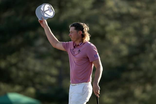 Cameron Smith tips his hat to the crowd on the 18th green after finishing his final round in last year's Masters. Picture: Gregory Shamus/Getty Images.