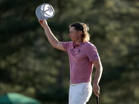 Cameron Smith tips his hat to the crowd on the 18th green after finishing his final round in last year's Masters. Picture: Gregory Shamus/Getty Images.