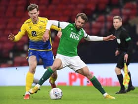 Jamie McCart and Hibs striker Christian Doidge battle for possession during St Johnstone's win at Hampden earlier in the season. Picture: SNS