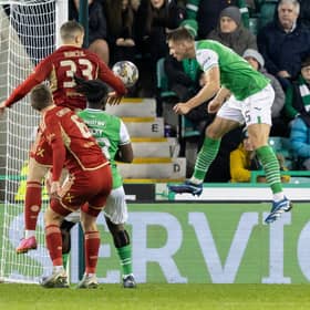 Will Fish heads home Hibs' second goal.