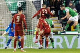 Will Fish heads home Hibs' second goal.