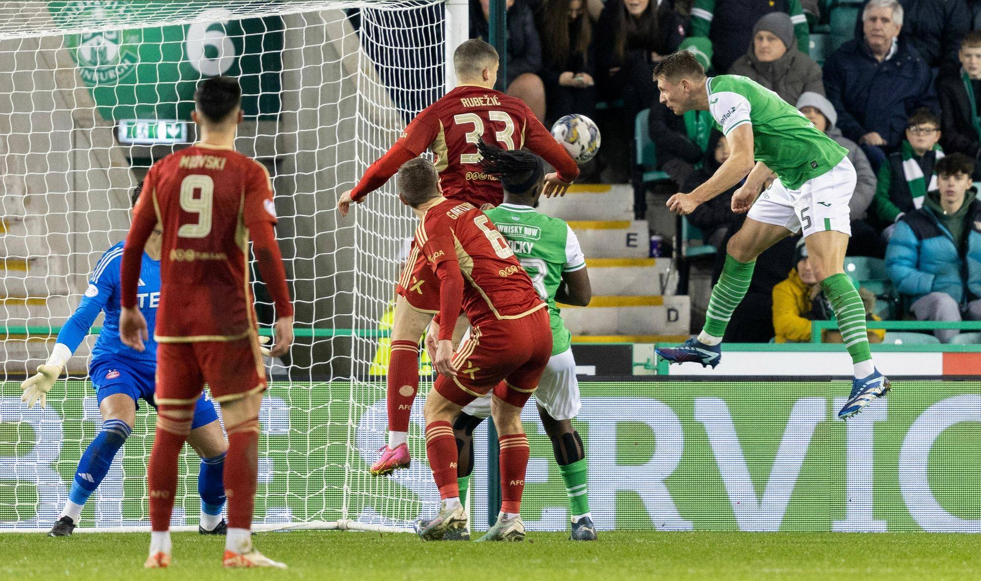 Will Fish heads home Hibs' second goal.