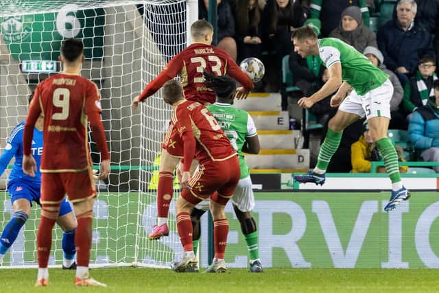 Will Fish heads home Hibs' second goal.
