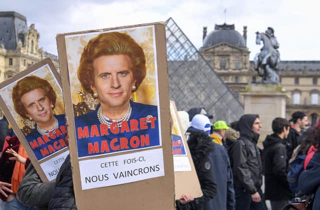 Protesters hold placards reading "Maragaret Macron, this time we will win" with a photomontage of both late British Prime Minister Margaret Thatcher and French President Emmanuel Macron during a strike in February (Picture: Alain Jocard/AFP via Getty Images)