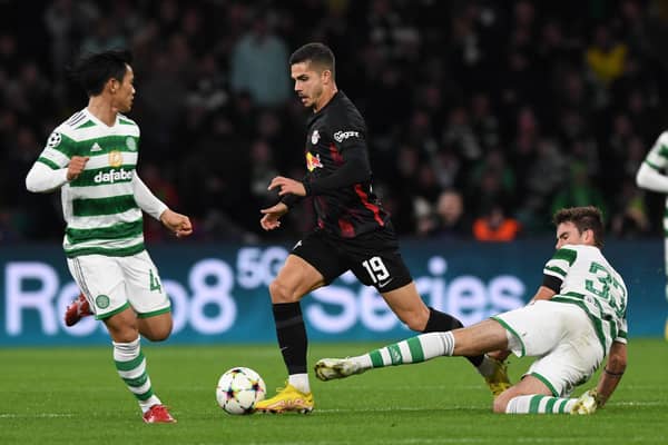 Celtic midfielder Matt O'Riley challenges RB Leipzig's Andre Silva during a UEFA Champions League Group F match earlier in the season.